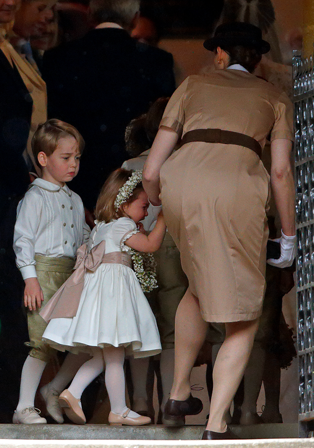 Princess Charlotte was pictured crying after it looked like Prince George grabbed a flower crown from her hands. Photo: Getty