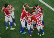 Croatia's players celebrate an own goal by Brazil's Marcelo during their 2014 World Cup opening match at the Corinthians arena in Sao Paulo June 12, 2014. (REUTERS/Fabrizio Bensch)