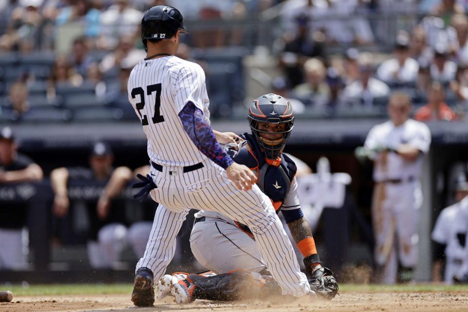 NEW YORK, NY - AUGUST 5: Martin Maldonado #15 of the Houston Astros waits to tag out Giancarlo Stanton #27 of the New York Yankees during the third inning at Yankee Stadium on August 5, 2023 in New York City. (Photo by Adam Hunger/Getty Images)