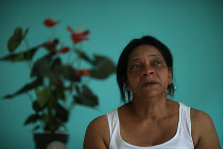 Maria Rosalina Rafael da Silva, mother of military police officer Alda Rafael Castilho, who was killed in the Penha complex, reacts during an interview in Rio de Janeiro, Brazil, September 1, 2018. Castilho was killed during an attack on the Peacekeeping Police Unit (UPP) headquarters in the slum in 2014 when she was in service. REUTERS/Pilar Olivares