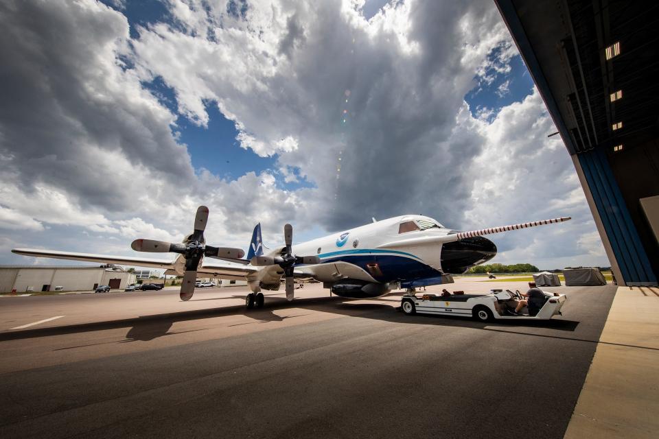 The NOAA hurricane hunter P3 Orion aircraft nicknamed Kermit is towed back into their hangar after engine testing at NOAA's Aircraft Operations Center at Lakeland Linder Airport in Lakeland. NOAA crews are preparing their aircraft for the upcoming hurricane season. ERNST PETERS/ THE LEDGER