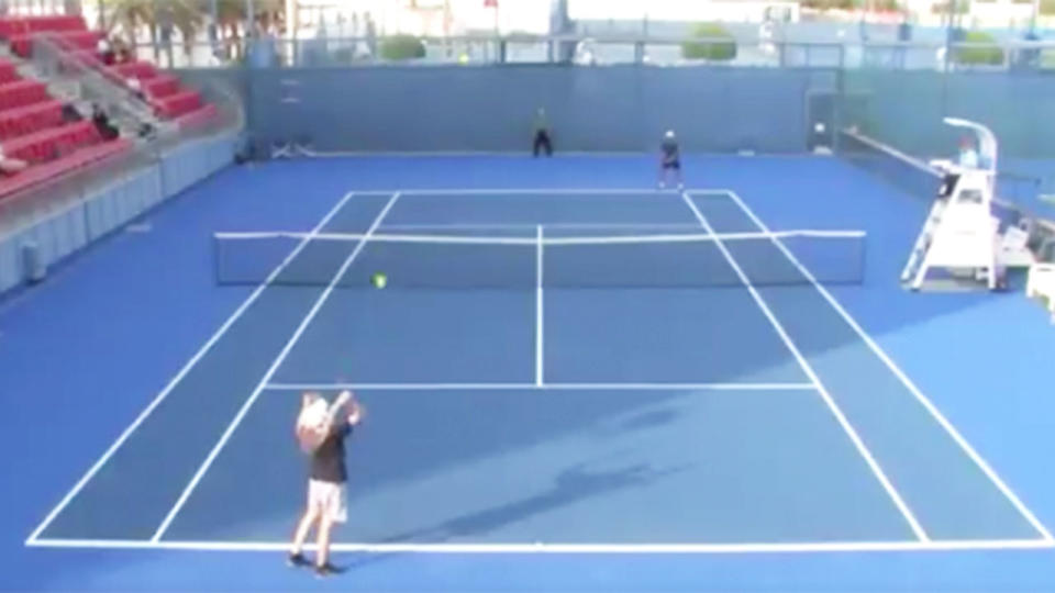 Artem Bahmet serving against his opponent in Doha.