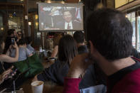 <p>People watch as former FBI director James Comey testifies during a Senate Intelligence Committee hearing, June 8, 2017, at the Building on Bond in the Brooklyn borough of New York. (Mary Altaffer/AP) </p>