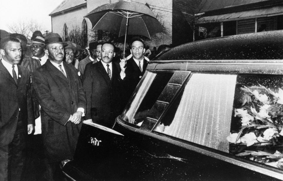 FILE - From left, John Lewis, Rev. Ralph Abernathy, Martin Luther King, Jr. and Rev. Andrew Young lead a procession following the casket of Jimmy Lee Jackson during a funeral service in Marion, Ala, on March 1, 1965. Young, one of the last surviving members of Martin Luther King Jr.'s inner circle, recalled the journey to the signing of the Voting Rights Act as an arduous one, often marked by violence and bloodshed. (AP Photo, File)