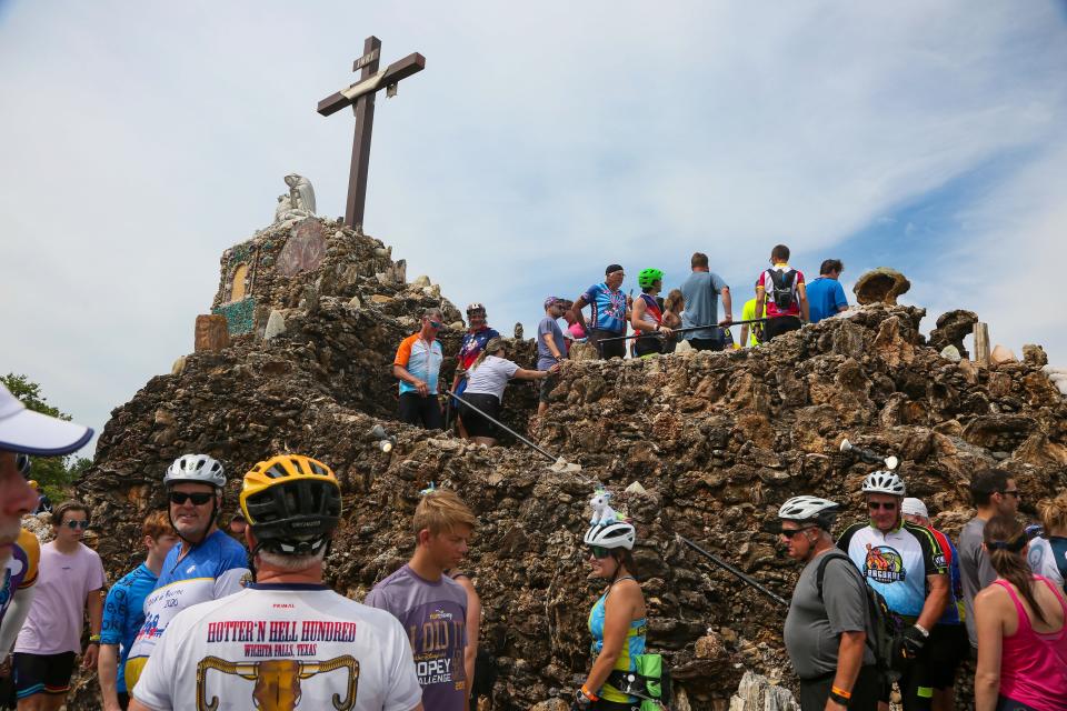 Riders stop at the Grotto of the Redemption in West Bend on the third day of RAGBRAI in 2022.