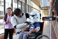SYDNEY, AUSTRALIA - APRIL 11: Jacob French meets with patients Helena Kantarelis and Zak Brankstone at the Sydney Children's Hostpital on April 4, 2012 in Sydney, Australia. French today completed the over 5,000 km trek from Perth to Sydney on foot, donning a full body stormtrooper costume he successfully raised over $100,000 for the Starlight Children's Foundation. Since July 2011, Jacob has walked 10 hours a day, Monday to Friday, lost over 12kg in weight, and gone through seven pairs of shoes. The Starlight Children's Foundation provides programs to help lift the spirits of sick children in hospitals accross Australia. (Photo by Cameron Spencer/Getty Images)