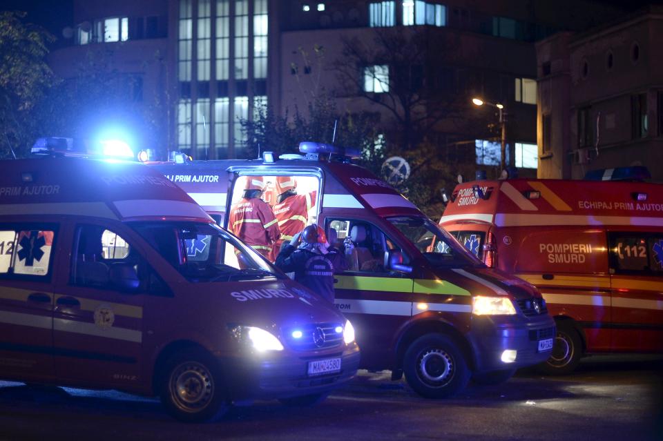 Emergency services work outside a nightclub in Bucharest, Romania October 31, 2015. Twenty five died in a nightclub blast and fire late on Friday and at least 88 people were admitted to hospital, government officials said. REUTERS/Inquam Photos THIS IMAGE HAS BEEN SUPPLIED BY A THIRD PARTY. IT IS DISTRIBUTED, EXACTLY AS RECEIVED BY REUTERS, AS A SERVICE TO CLIENTS. ROMANIA OUT. NO COMMERCIAL OR EDITORIAL SALES IN ROMANIA.