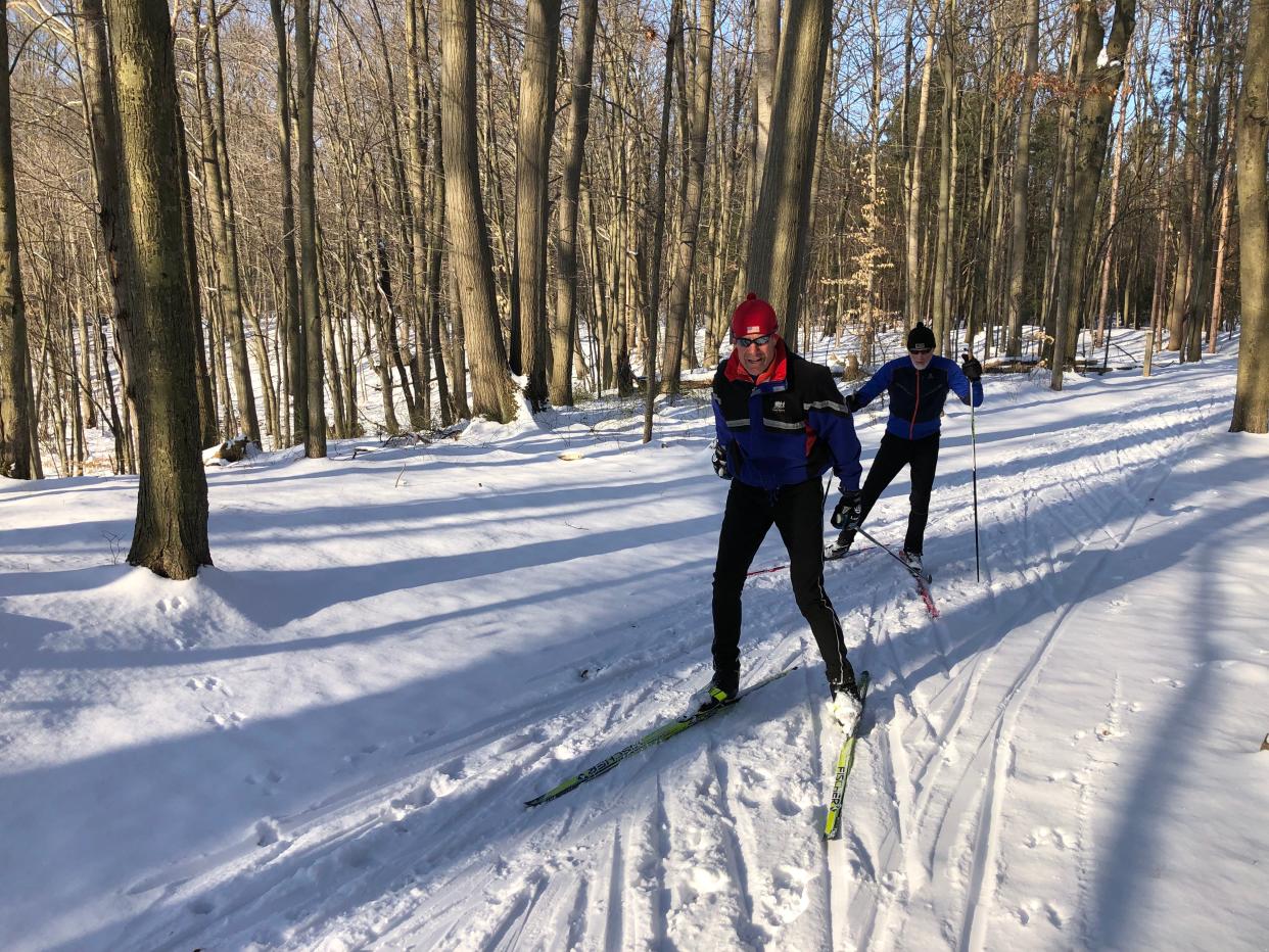 Skiers seize a sudden blessing of sufficient snow on Feb. 18, 2023, at Pigeon Creek County Park north of Holland, Mich.