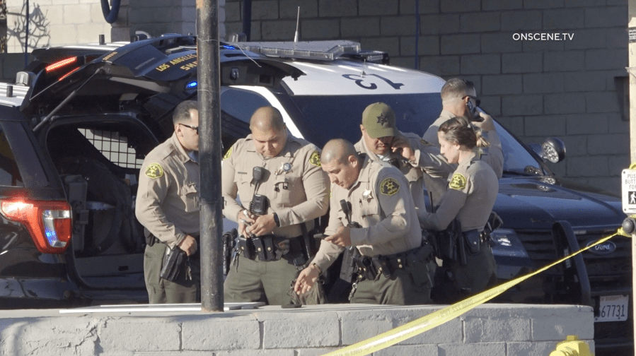 Deputies from the Los Angeles County Sheriff’s Department investigate a shooting at a gas station in Bellflower where an off-duty LAPD officer was struck by a bullet. LASD says it appears the officer was caught in the crossfire of a gang-related shooting on May 5, 2024. (OnScene.TV)