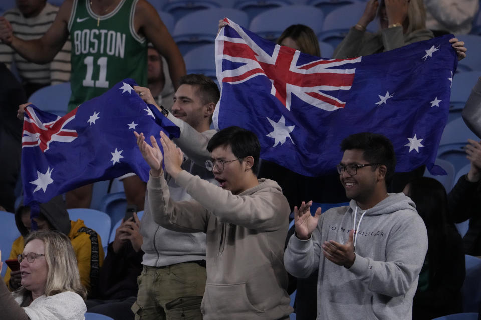 Supporters cheer during a match between Andy Murray of Britain and Thanasi Kokkinakis of Australia at the Australian Open tennis championship in Melbourne, Australia, Friday, Jan. 20, 2023. (AP Photo/Ng Han Guan)