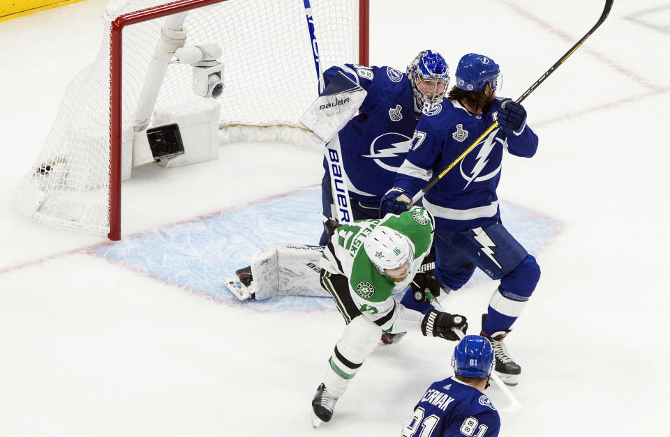 Dallas Stars' Joe Pavelski (16) scores against Tampa Bay Lightning goalie Andrei Vasilevskiy (88) as Lightning defenseman Ryan McDonagh (27) defends during second-period NHL Stanley Cup finals hockey action in Edmonton, Alberta, Monday, Sept. 21, 2020. (Jason Franson/The Canadian Press via AP)