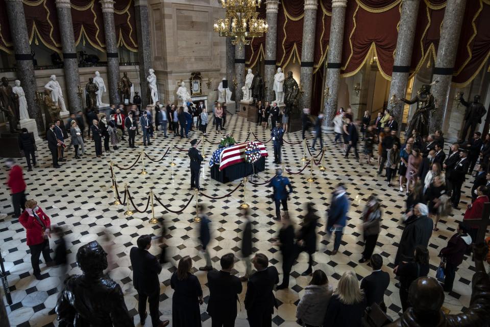 Visitors file past the flag-draped casket of Rep. Don Young, R-Alaska, as he lies in state in Statuary Hall at the U.S. Capitol on March 29, 2022. <a href="https://www.gettyimages.com/detail/news-photo/visitors-file-past-a-flag-draped-casket-of-rep-don-young-as-news-photo/1239598559?phrase=Don%20Young&adppopup=true" rel="nofollow noopener" target="_blank" data-ylk="slk:Drew Angerer/Getty Images;elm:context_link;itc:0;sec:content-canvas" class="link ">Drew Angerer/Getty Images</a>