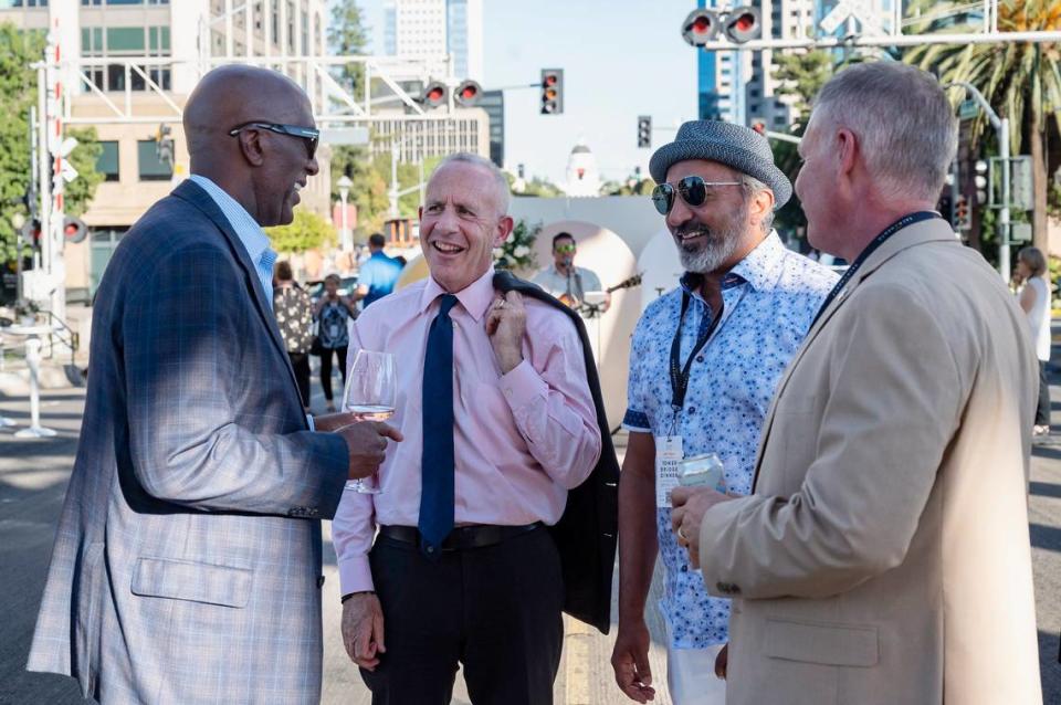 Sacramento Sheriff Jim Cooper, left, talks with Mayor Darrell Steinberg, second to left, Congressman Ami Bera, second to right, and Sacramento County Undersheriff Mike Ziegler, right, at the Tower Bridge Dinner on the Tower Bridge between Sacramento and West Sacramento on Sunday.