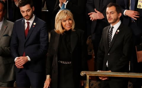 Brigitte Macron arrives in the House of Representatives ahead of her husband's speech  - Credit: AP