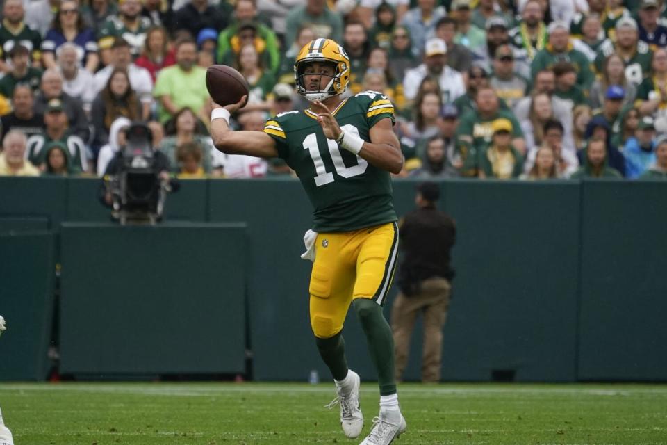 Green Bay Packers quarterback Jordan Love (10) throws a side-arm pass.