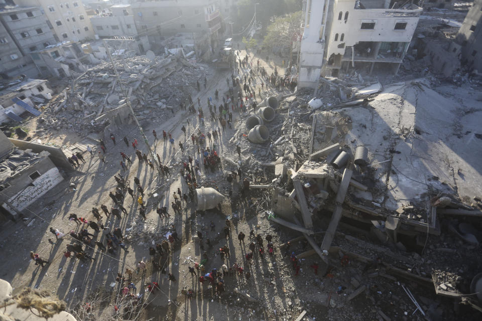 Palestinians look at the destruction after an Israeli strike on residential buildings and a mosque in Rafah, Gaza Strip, Thursday, Fe. 22, 2024(AP Photo/Hatem Ali)