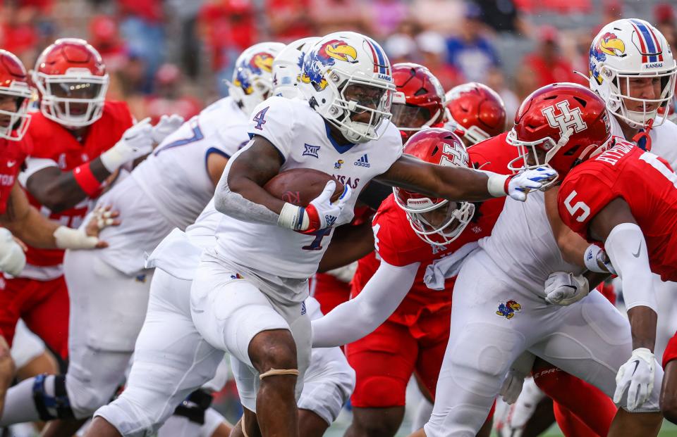 Sep 17, 2022; Houston, Texas, USA; Kansas Jayhawks running back Devin Neal (4) runs with the ball during the first quarter against the Houston Cougars at TDECU Stadium.