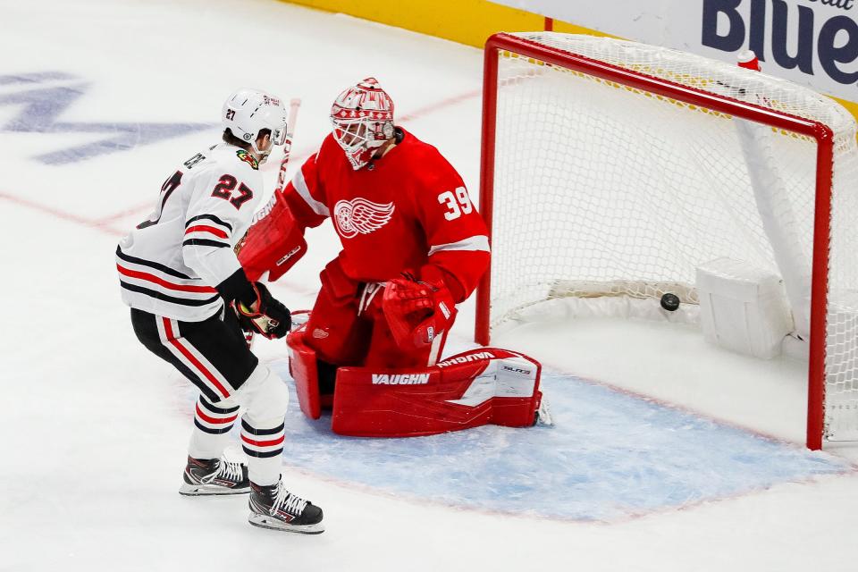 Chicago Blackhawks left wing Lukas Reichel (27) scores a goal against Detroit Red Wings goaltender Alex Nedeljkovic (39) during the first period of a preseason game at Little Caesars Arena in Detroit on Wednesday, Sept. 28, 2022.