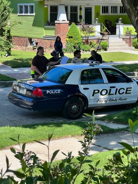 A prop police car is parked while a film crew works on Seventh Street June 12, 2022 in Sheboygan, Wis.