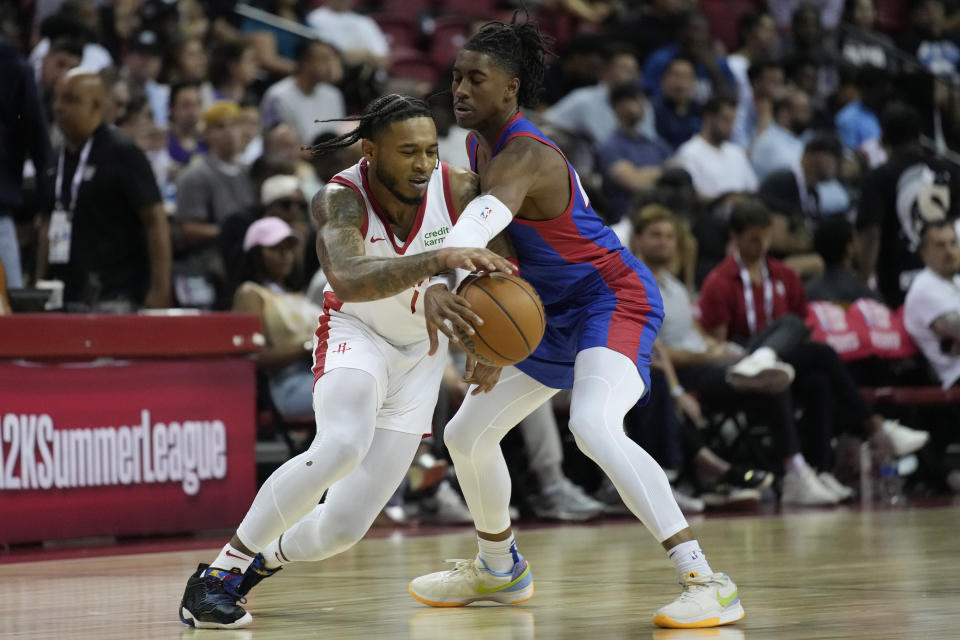 Detroit Pistons' Jaden Ivey, right, steals the ball from Houston Rockets' Cam Whitmore during the second half of an NBA summer league basketball game Sunday, July 9, 2023, in Las Vegas. (AP Photo/John Locher)