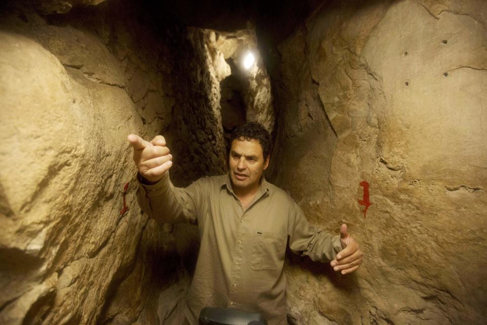 In this Thursday, May 1, 2014, photo, Eli Shukron, an archeologist formerly with Israel's Antiquities Authority, walks in the City of David archaeological site near Jerusalem's Old City. The dig, which began in 1995, uncovered a massive fortification and pottery shards that date to 3,800 years old. Shukron says this is the legendary citadel captured by King David in his conquest of Jerusalem. But archaeologists are divided on identifying Davidic sites in Jerusalem, the city he is said to have made his capital. (AP Photo/Sebastian Scheiner)