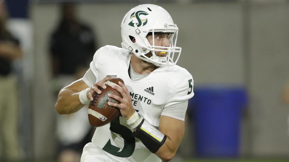 Sacramento State quarterback Kevin Thomson (5) looks to pass against Arizona State during the first half of an NCAA college football game, Friday, Sept. 6, 2019, in Tempe, Ariz. (AP Photo/Matt York)