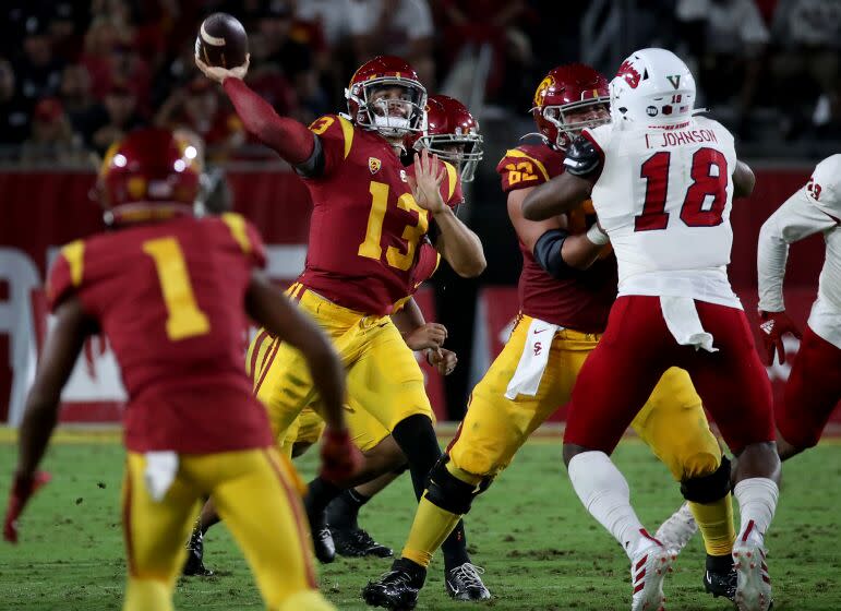 LOS ANGELES, CALIF. - SEP. 17, 2022. USC quarterback Caleb Williams throws downfield during the game against Fresno State at the Coliseum in Los Angeles. on Saturday night, Sep. 17, 2022. (Luis Sinco / Los Angeles Time