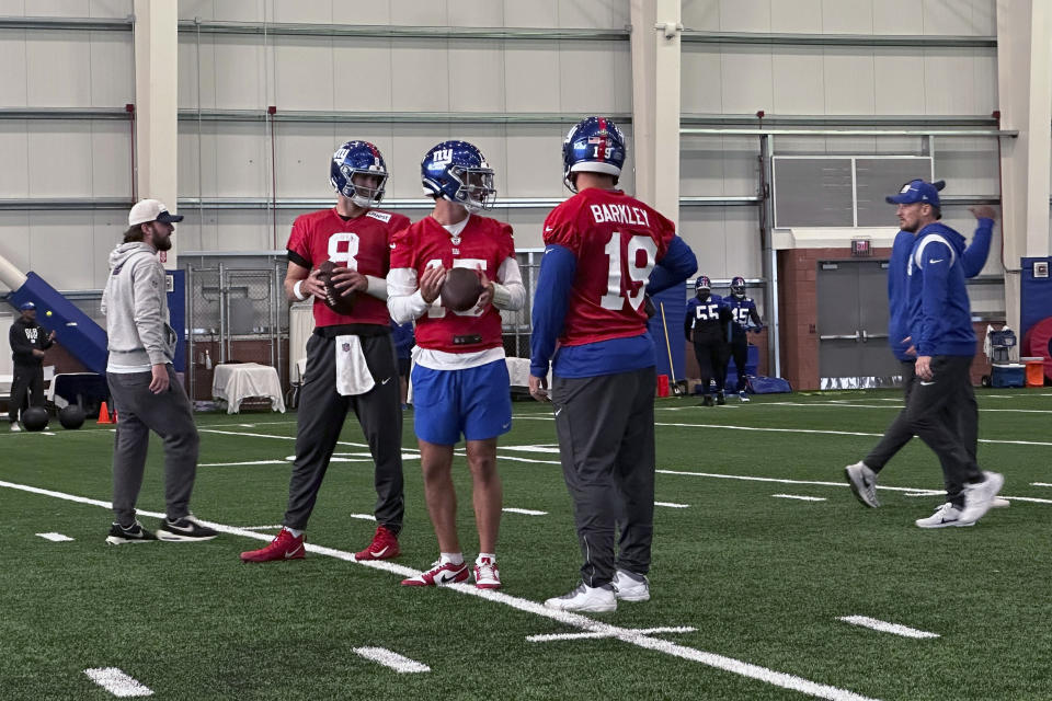 New York Giants' Daniel Jones (8), Tommy DeVito (15) and Matt Barkley (19) talk during NFL football practice in East Rutherford, N.J., Wednesday, Nov. 1, 2023. (AP Photo/Tom Canavan)