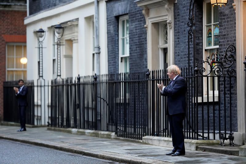 Britain's Prime Minister Boris Johnson takes part in a 'Clap for Carers' campaign in London