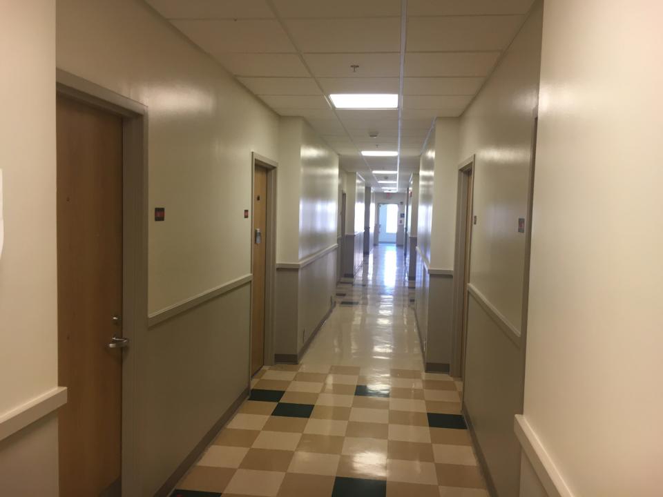 An empty hallway inside a "living center" at Grand Valley State University will be filled with students this fall as they return to classes.