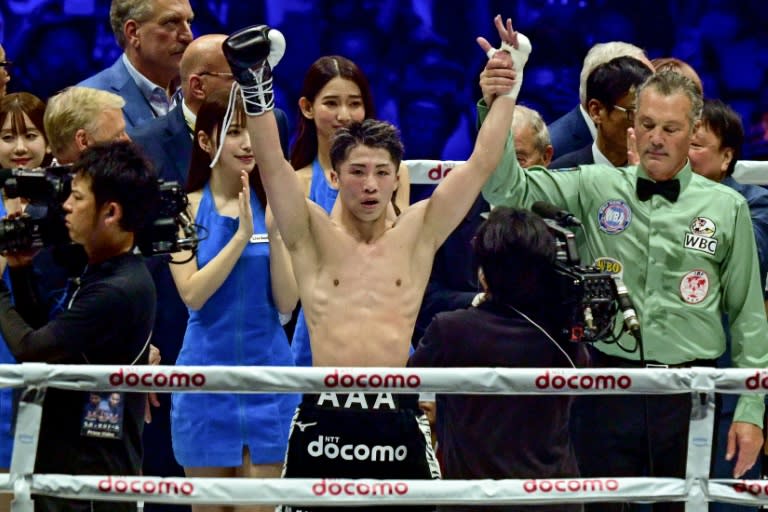 Japanese boxer Naoya Inoue celebrates his victory over <a class="link " href="https://sports.yahoo.com/soccer/teams/mexico/" data-i13n="sec:content-canvas;subsec:anchor_text;elm:context_link" data-ylk="slk:Mexico;sec:content-canvas;subsec:anchor_text;elm:context_link;itc:0">Mexico</a>'s Luis Nery in their IBF-WBA-WBC-WBO super-bantamweight title fight at the Tokyo Dome (Philip FONG)