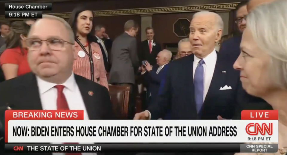 President entering House Chamber for State of the Union Address with officials around