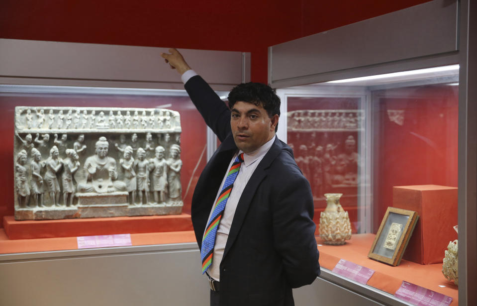 In this Saturday, Aug. 17, 2019 photo, Museum Director Mohammad Fahim Rahimi, speaks with The Associated Press at the National Museum of Afghanistan in Kabul, Afghanistan. The Taliban fighters arrived with hammers and hatred. What they left behind is laid out on tables at the National Museum of Afghanistan, 18 years later. A few hundred objects have been restored in recent years. Rahimi is very concerned about the potential Taliban return and is making plans to protect the museum’s holdings. (AP Photo/Rafiq Maqbool)