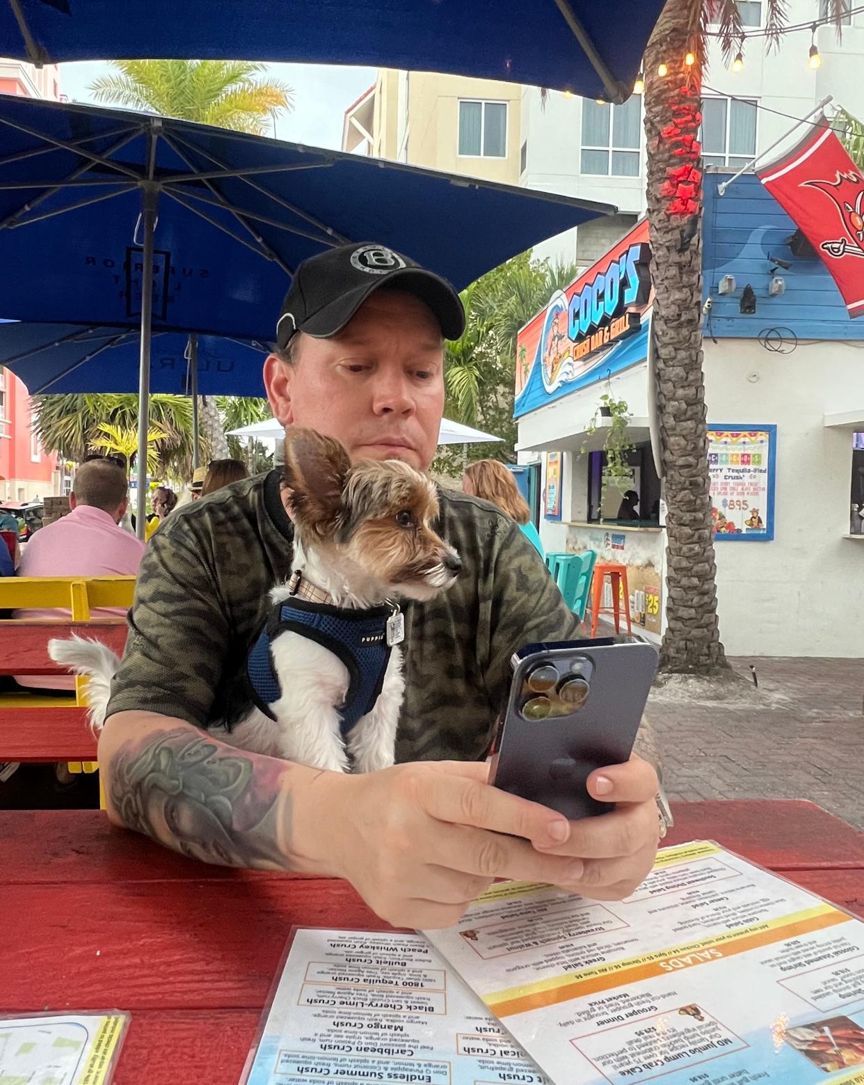 Brian Buxton, pictured here with his Yorkie Riley, started Fingers, Fork, Knife and Spoon on Facebook to review restaurants he visited out of town, but it has become the spot to find breaking restaurant news.