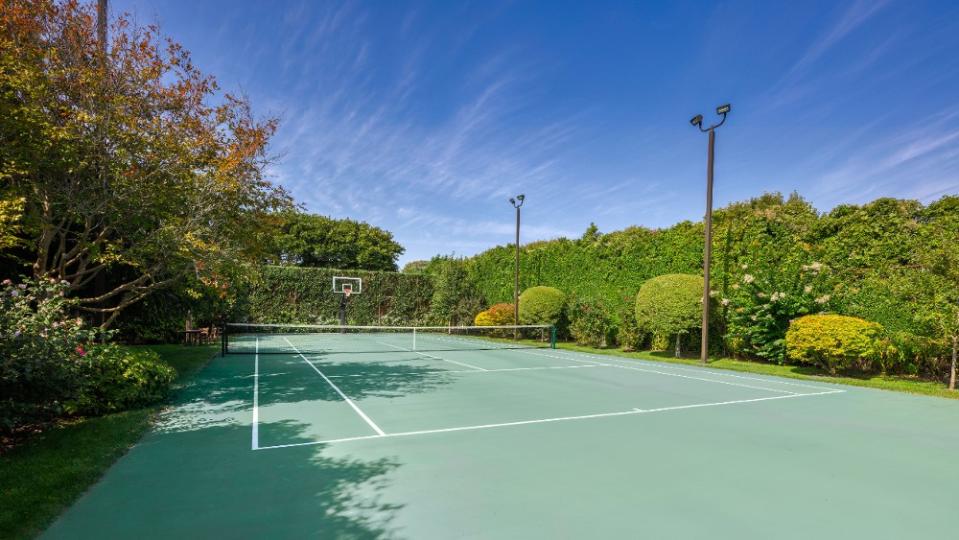 This is the only private lit court in all of the Hamptons. - Credit: Douglas Elliman