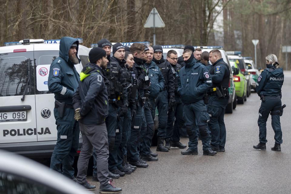 Police officers patrol the area near the house of Leonid Volkov, a close associate of the late Russian opposition leader Alexei Navalny, in Vilnius, Lithuania, Wednesday, March 13, 2024. Volkov on Wednesday blamed the government of Russian President Vladimir Putin after he was attacked with a hammer and tear gas outside his home near the Lithuanian capital, where he lives in exile, the late Navalny's anti-corruption foundation said.(AP Photo/Mindaugas Kulbis)