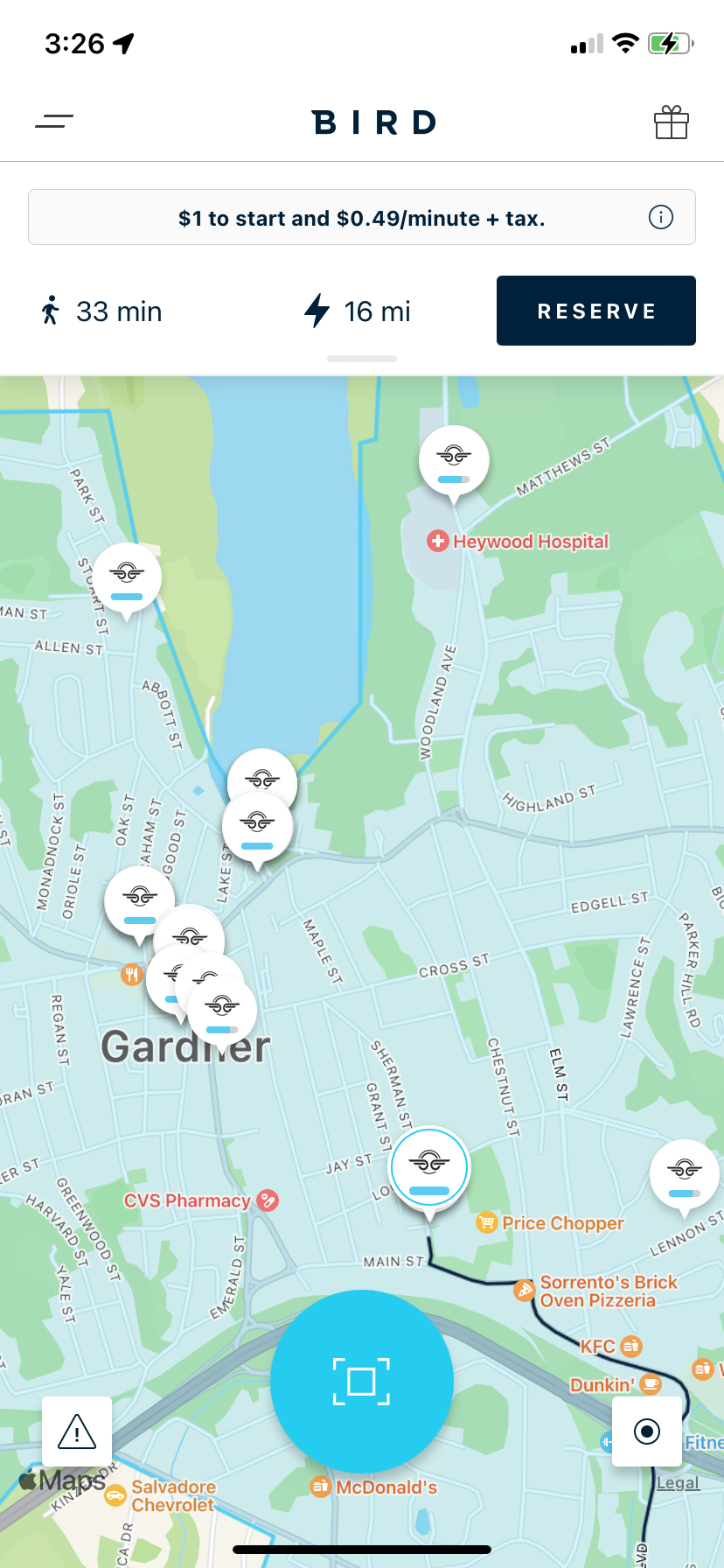 The Bird app display shows the location of available e-scooters in Gardner.