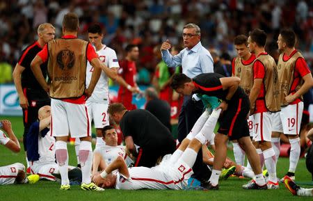 Football Soccer - Poland v Portugal - EURO 2016 - Quarter Final - Stade Velodrome, Marseille, France - 30/6/16 Poland head coach Adam Nawalka speaks with his players before extra time REUTERS/Kai Pfaffenbach Livepic