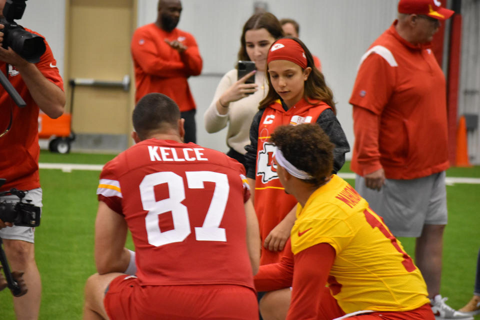 Myka Eilers strategizes with Kansas City Chiefs players Travis Kelce and Patrick Mahomes on the field as part of her Make-A-Wish experience in 2022.   (Courtesy Make-A-Wish Foundation)