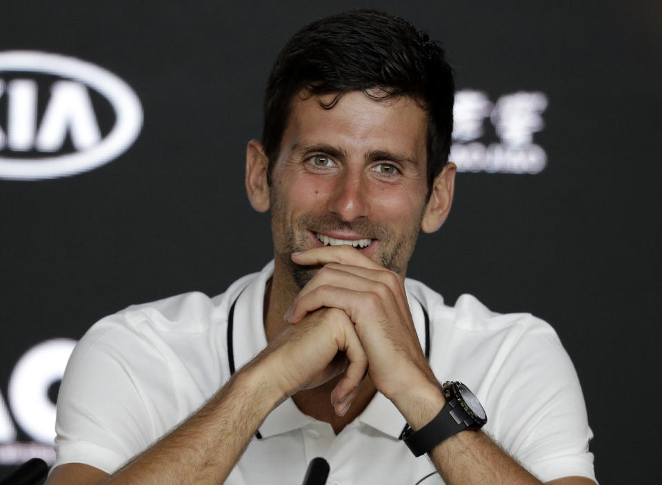 Serbia's Novak Djokovic smiles during a press conference at the Australian Open tennis championships in Melbourne, Australia, Sunday, Jan. 13, 2019. (AP Photo/Aaron Favila)