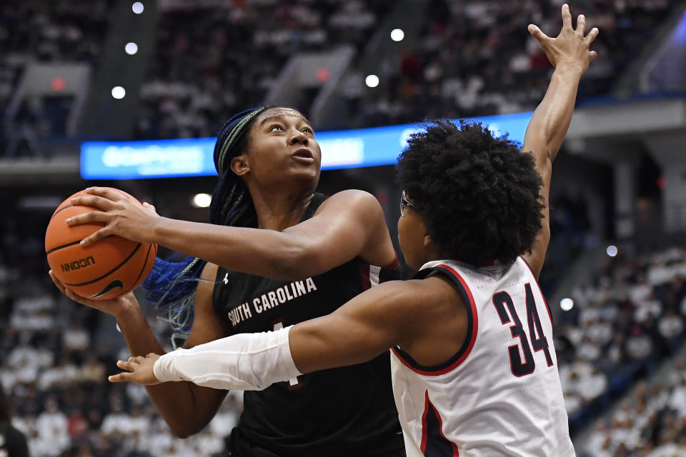 South Carolina's Aliyah Boston looks to shoot as UConn's Ayanna Patterson (34) defends in the second half of an NCAA college basketball game, Sunday, Feb. 5, 2023, in Hartford, Conn. (AP Photo/Jessica Hill)