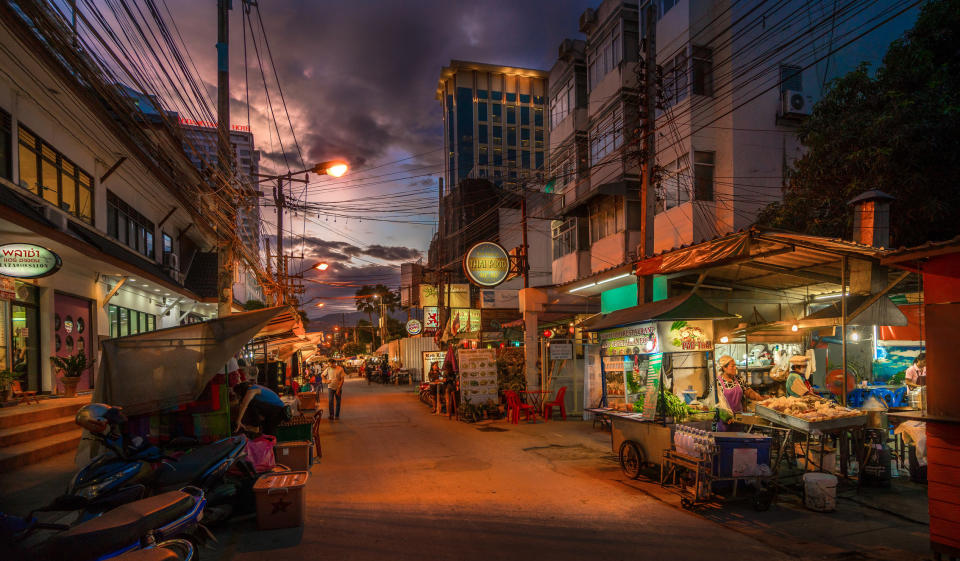 Food stands at dusk.