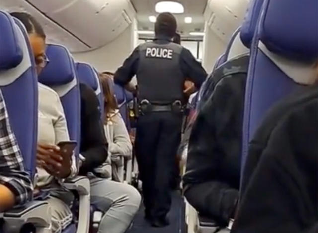 Passenger on flight arriving in Miami from Colombia opens plane door, jumps  on wing