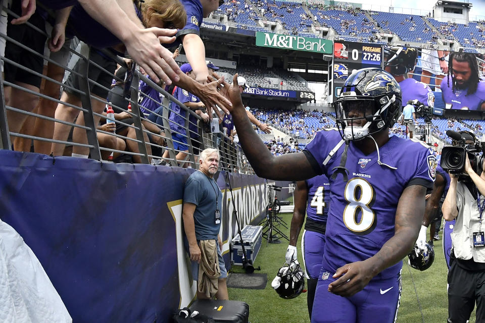 FILE - In this Sept. 29, 2019, file photo, Baltimore Ravens quarterback Lamar Jackson acknowledges fans prior to an NFL football game against the Cleveland Browns in Baltimore. All those home-field advantages seen across the league, like Baltimore, Denver, Green Bay, New Orleans, Pittsburgh and Seattle, could be mostly wiped out by the coronavirus pandemic in 2020. (AP Photo/Brien Aho, File)