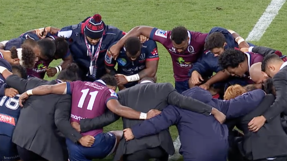 Reds and Rebels players prayed together. Image: Fox Sports