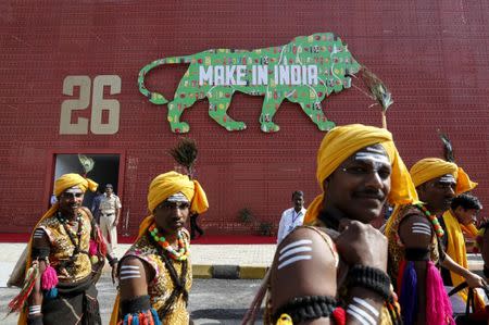 FILE PHOTO: Performers walk at the exhibition centre of the 'Make In India' week in Mumbai, India, February 13, 2016. REUTERS/Danish Siddiqui/File Photo