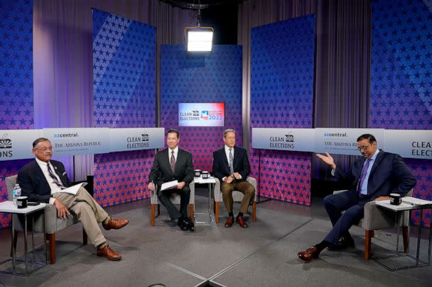 PHOTO: Arizona Secretary of State Democratic candidate Adrian Fontes, right, and Republican candidate Mark Finchem, left, go over ground rules prior to their debate, Thursday, Sept. 22, 2022, in Phoenix. (Matt York/AP)