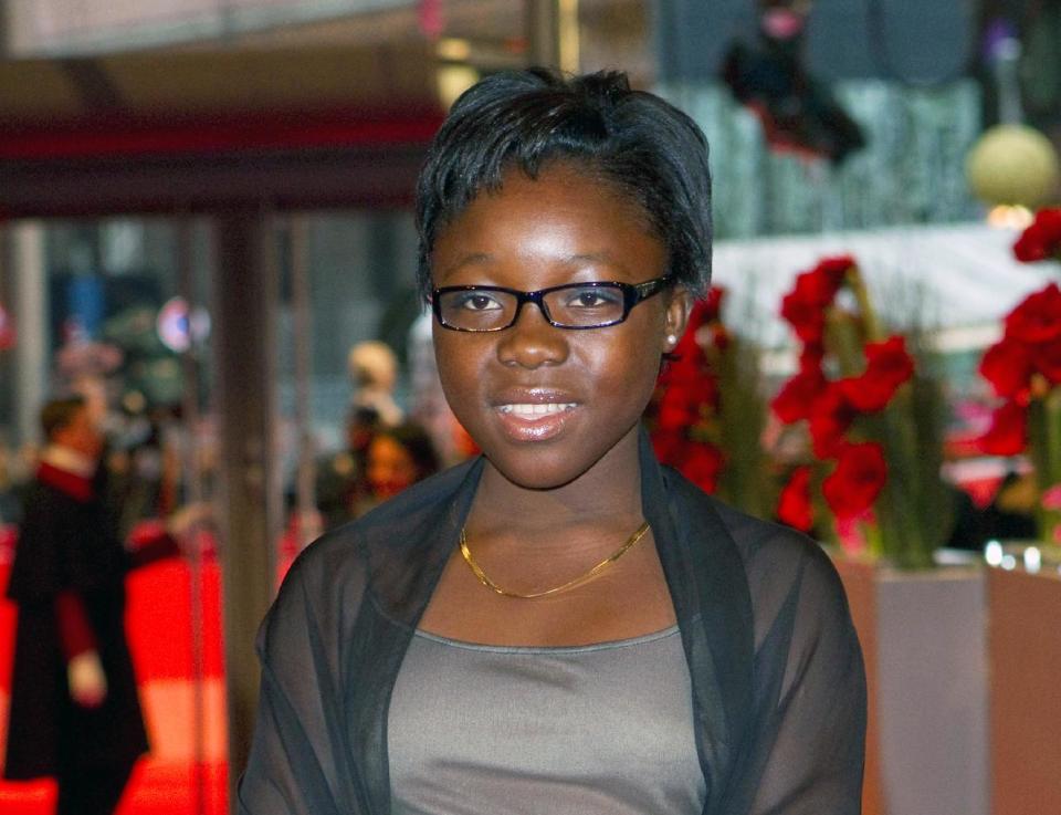 FILE - This Feb. 17, 2012 file photo shows actress Rachel Mwanza arrives for the screening of the film "War Witch" (Rebelle) at the 62 edition of International Film Festival Berlinale, in Berlin. Mwanza has been granted a visa to travel from the Congo for the Academy Awards. The film was nominated for an Academy Award for best foreign picture on Jan. 10, 2013. The 85th Academy Awards will air live on Sunday, Feb. 24. (AP Photo/Gero Breloer, file)