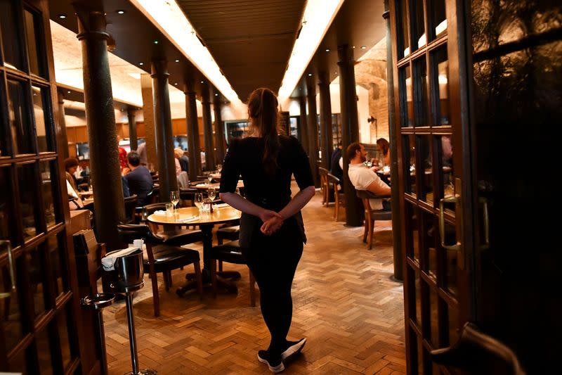 Staff work at Hawksmoor, on the opening day of "Eat Out to Help Out" scheme in London