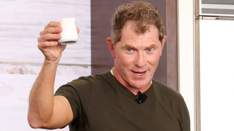 bobby flay holding white container